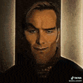 a close up of a man 's face with a tik tok watermark