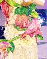 a close up of a dress with flowers and leaves that says tumblr