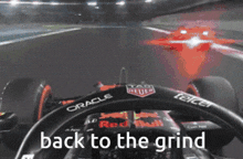 a picture of a race car with the words back to the grind above it
