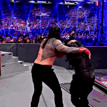 Roman Reigns Throws GIF - Roman Reigns Throws Seth Rollins GIFs