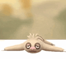 a stuffed animal is laying on its back on a white table