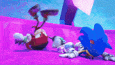 sonic the hedgehog and knuckles are playing a video game and sonic is laying on the ground .