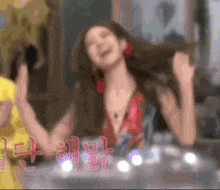 a blurry picture of a woman giving a high five with chinese characters in the background