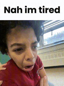 a child is making a funny face and the words nah im tired are above him