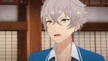 a young boy with gray hair and yellow eyes is wearing a blue jacket and white shirt .