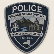a patch that says police village of malone ny heart of franklin county est. 1802