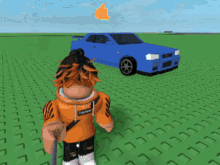 a boy in an orange hoodie is standing in front of a blue car that has crashed