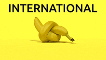 two bananas tied together on a yellow background with the word international above them