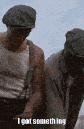 two men standing next to each other with the words " i got something " on the bottom