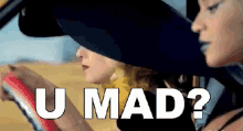 two women are sitting in a car with the words u mad written on the screen