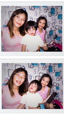 a woman and two children pose for a picture in front of a wall with doraemon on it