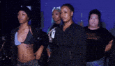 a group of women posing for a photo with one wearing a shirt that says nc