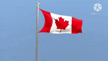 a canadian flag is waving in the wind with a blue sky in the background