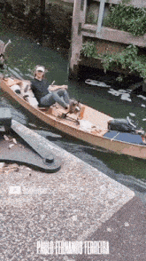 paulo fernando ferreira is sitting in a boat
