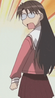 a girl with long hair and glasses is wearing a red shirt and a red skirt .