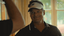 a man wearing a hat with the word chad powers written on it