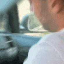 a blurry picture of a man in a car