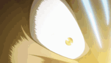 a close up of a person 's eye with a light coming from it