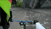 a person is riding a bike down a brick road