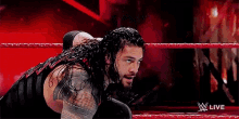 Reigns Tongue Out GIF - Reigns Tongue Out Wwe GIFs