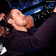 a man taking a selfie with joequinncraves written on the bottom