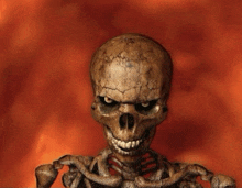 a skeleton with a cracked skull is smiling in front of flames