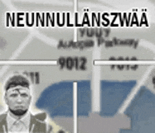 a man is standing in front of a map with a crosshair on it