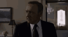 a man in a suit and tie says " must i destroy this man ? "