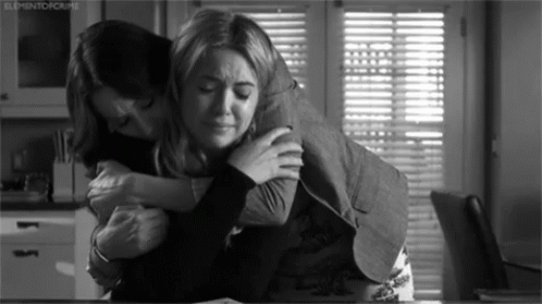 friends hugging and crying