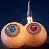 a pair of eyes with a whale and the letter f on them in front of a rocket