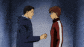a man in a blue jacket is shaking hands with a boy in a red jacket
