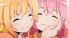 a couple of anime girls are kissing each other on the cheeks .