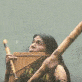 a man is playing a flute and a bamboo flute