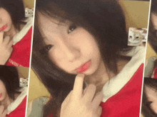 a girl taking a selfie with a cat in the background and a red shirt that says ' tokyo ' on it