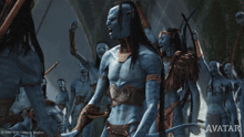 a movie poster for avatar shows a group of blue people