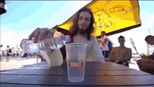 jesus pouring water into a cup that says ceres