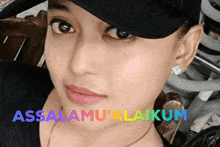 a close up of a woman 's face with the word assalamu ' alakum written on it