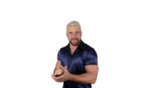 a man with a beard is wearing a blue shirt and dancing