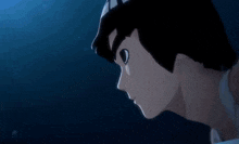 a close up of a person 's face in a dark room with a blue sky in the background .