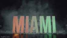 a sign that says miami in red and green letters