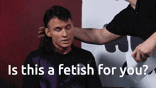 a man with a ponytail is being touched by another man with the words " is this a fetish for you " behind him
