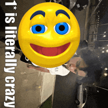 a man smoking a cigarette behind a smiley face that says ' it is literally crazy '