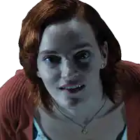 a close up of a woman 's face with a necklace on