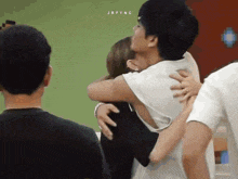 a man is hugging a woman with the name jrfying written on the bottom