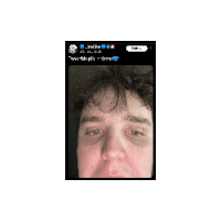 a close up of a man 's face on a phone screen with a clock on the bottom right
