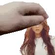 a hand is holding a woman 's face in front of a white background .