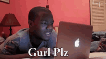 a man laying on a bed looking at a laptop with the words gurl plz written on the screen