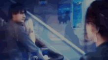 a blurry picture of a woman looking at herself in the mirror