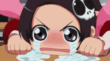a girl with a skull on her head is laying on the floor crying