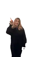 a woman in a black shirt is pointing up with her finger